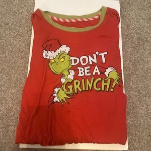 On the shirt it says Don’t be a grinch.